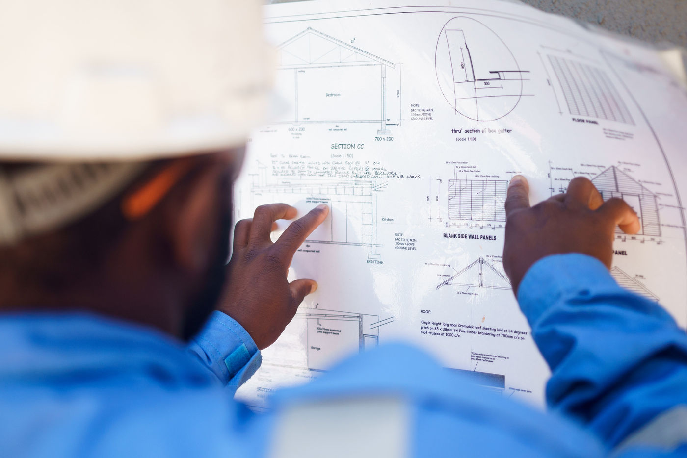 Person reviewing construction drawings