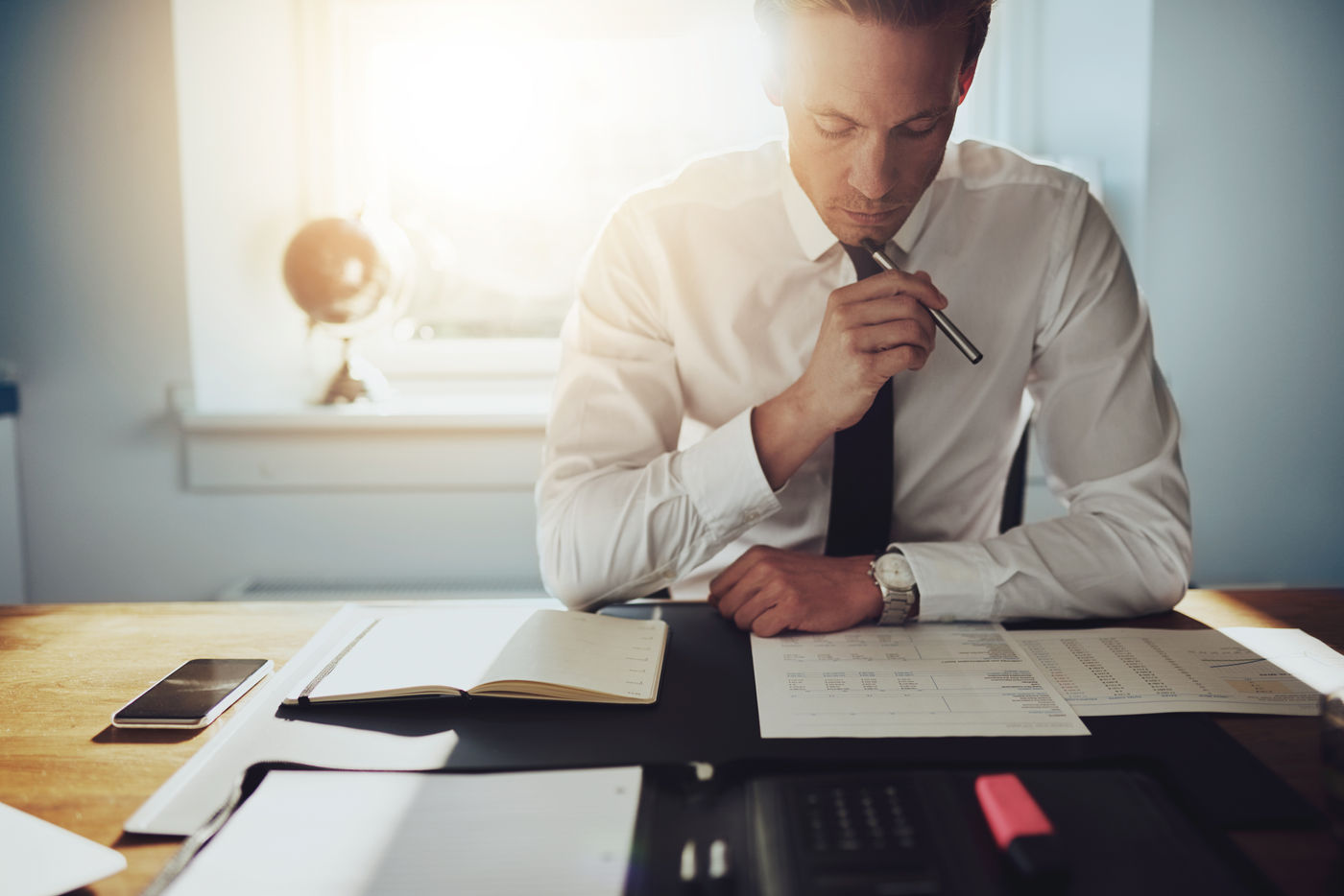 Man reviewing documents at a desk